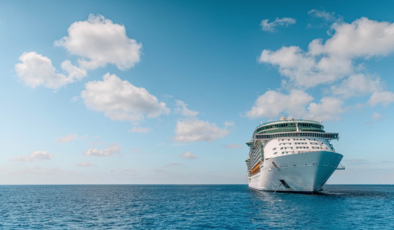 A large cruise ship anchored in the calms waters of the Cayman Islands